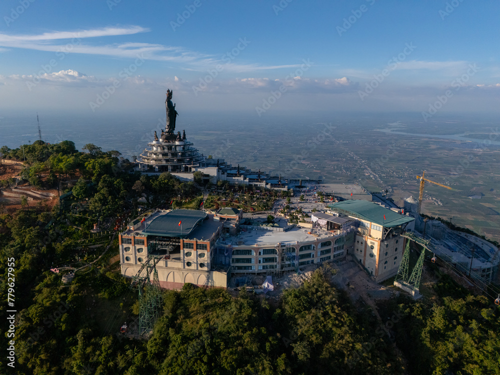 Fototapeta premium View of Ba Den mountain tourist area, Tay Ninh province, Vietnam. A unique Buddhist architecture with the highest elevation in the area view from below is very beautiful.