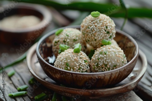 Onde onde an Indonesian snack is made with sticky rice flour rice flour sugar and green beans paste photo