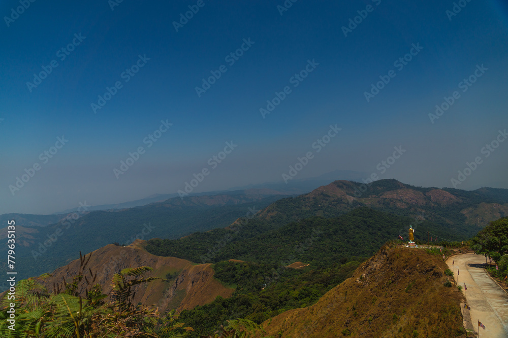 Fototapeta premium A mountain range with a clear blue sky in the background