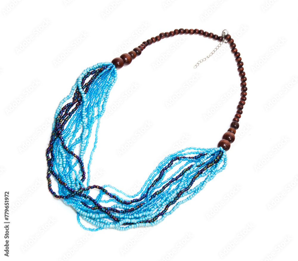 women's jewelry. bijouterie. Wooden beads with blue beads on a white isolated background, two metal hair clips. the view from the top.
women's jewelry. bijouterie. Wooden beads with blue beads on a white isolated background, two metal hair clips. the view from the top.