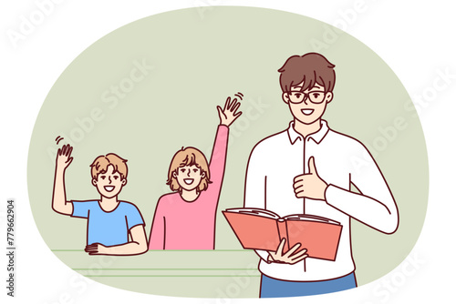 Man teacher with textbook stands near students sitting at school desk and raising hand. Father gives quality education to children by helping to prepare for exams for elementary school © drawlab19