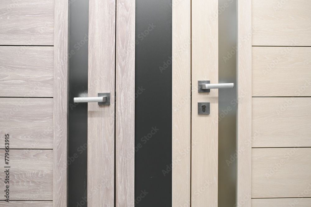 Doors are sold at a hardware store. Choosing doors for the house close-up. Interior renovation concept Doors are sold at a hardware store. Choosing doors for the house close-up. Interior renovation concept