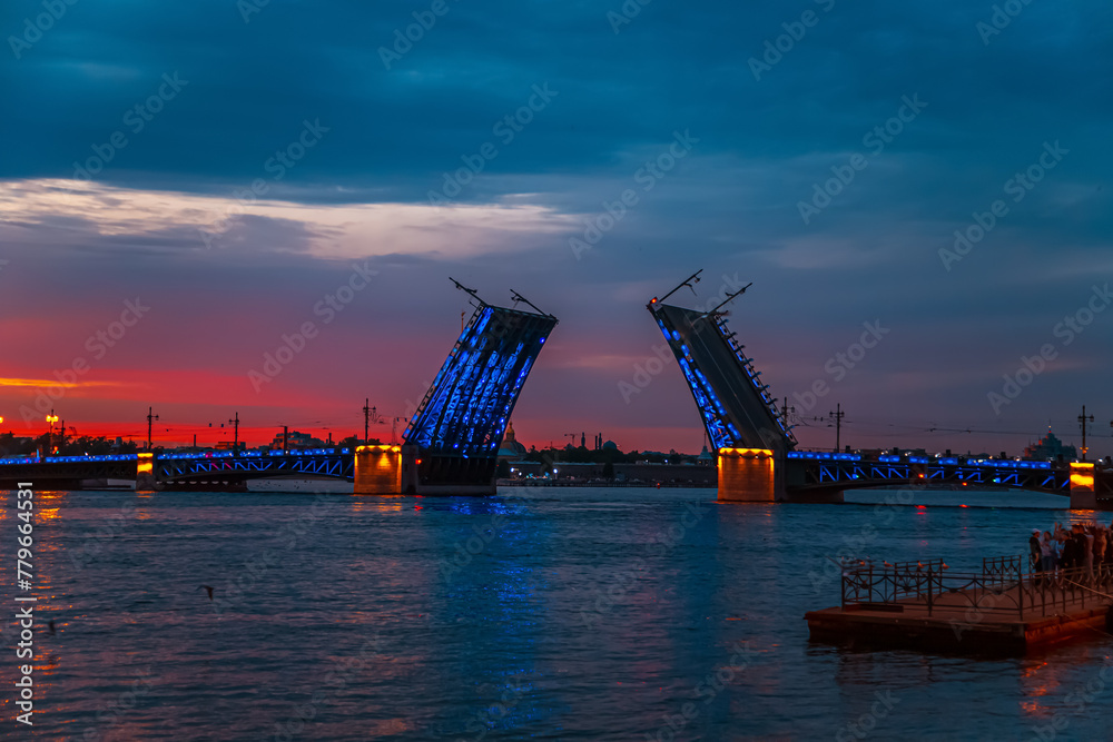 Open Palace Bridge in St. Petersburg on a white night.