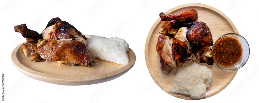 Juicy grilled chicken wing on wood plate and spicy Thai style sauce isolated on white background. Thai food Juicy grilled chicken wing on wood plate and spicy Thai style sauce isolated on white background. Thai food