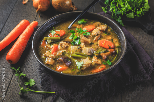 Homemade meat and vegetable stew or soup with mushrooms