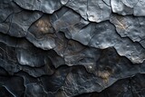 A high quality image showing a rugged black stone surface, portraying strength and resilience