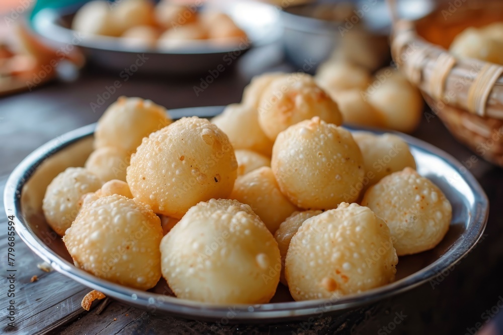 Zoomed in image of tiny mandazi on a plate Zoomed in image of tiny mandazi on a plate