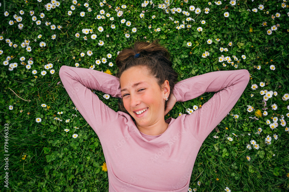 A little girl lying happy in the garden. A little girl lying happy in the garden.