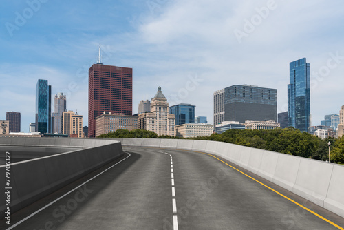 Empty urban asphalt road exterior with city buildings background. New modern highway concrete construction. Concept of way to success. Transportation logistic industry fast delivery. Chicago. USA. © VideoFlow