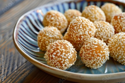 Sesame topped onde onde snack with a sweet crunchy taste © VolumeThings