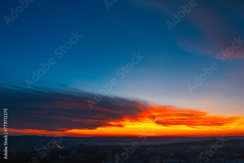 Colourful landscape of beautiful dark sunset or sunrise close to evening above the city. Natural abstract background.