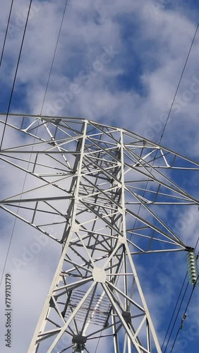 Power Lines Against Blue Sky. Vertical
