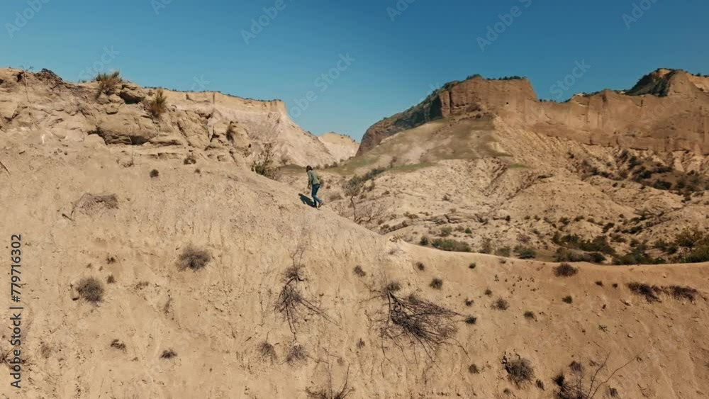 Adventure, Photographer walking On The Edge Of The Cliff in Vashlovani national park . Adventure, Photographer walking On The Edge Of The Cliff in Vashlovani national park .