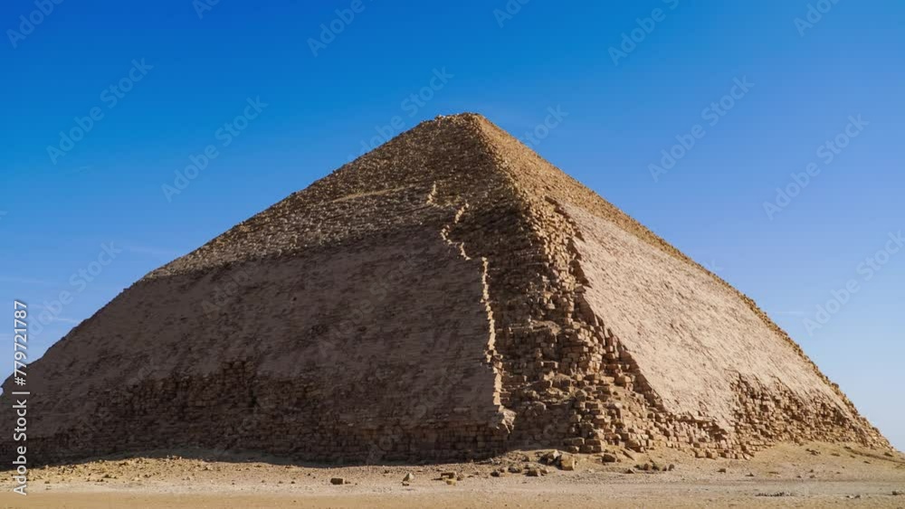The Bent Pyramid is an ancient Egyptian pyramid located at the royal necropolis of Dahshur, approximately 40 kilometres south of Cairo, built under the Old Kingdom Pharaoh Sneferu. Egypt The Bent Pyramid is an ancient Egyptian pyramid located at the royal necropolis of Dahshur, approximately 40 kilometres south of Cairo, built under the Old Kingdom Pharaoh Sneferu. Egypt