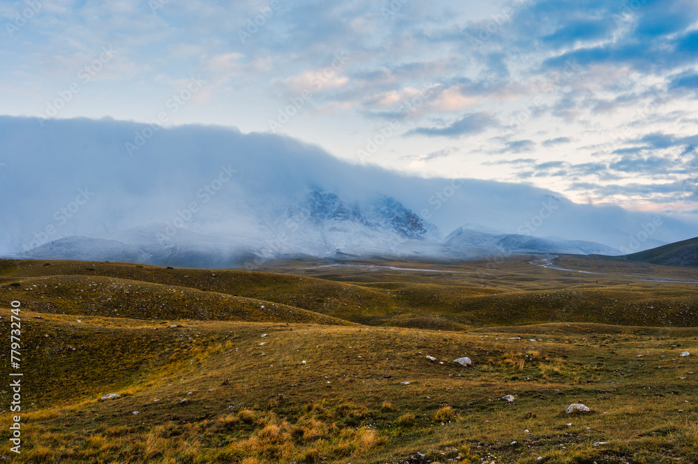 mountain landscape inside the National Park of Gran Sasso and Monti della Laga during an autumnal and cloudy morning, L'Aquila, Italy mountain landscape inside the National Park of Gran Sasso and Monti della Laga during an autumnal and cloudy morning, L'Aquila, Italy
