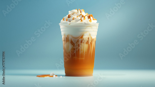 Iced caramel latte with whipped cream in plastic cup. Ad for cold coffee. Sky blue background. Summer drink concept.