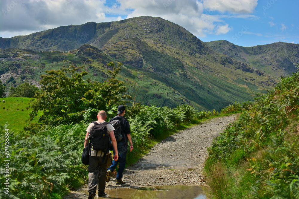 Hikers in Great Langdale, UK on a sunny day