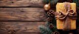 Background with gift box in vintage style on wooden planks. Concept of new year winter holidays. Empty space for caption or design. Top view. Web banner.