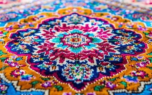 A richly detailed and colorful tapestry featuring an intricate, kaleidoscopic display of vibrant floral patterns in shades of blue, orange, pink, and gold.