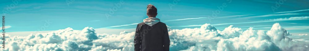 Fototapeta premium Man Contemplating Above the Clouds: Visions of Ambition and Freedom