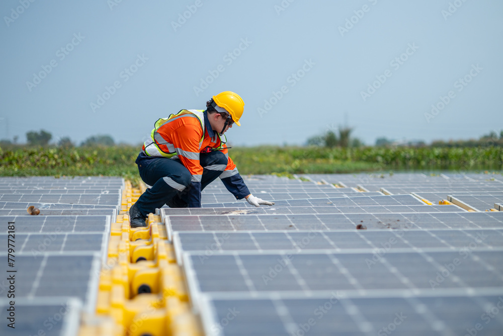 Engineer Inspecting Solar Panels at Power Plant Engineer Inspecting Solar Panels at Power Plant