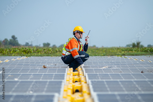 Wallpaper Mural Engineer Inspecting Solar Panels at Power Plant Torontodigital.ca