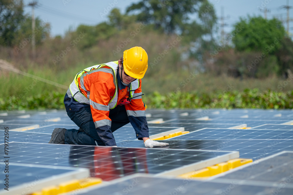 Solar Field Technician Examining Panel Efficiency Solar Field Technician Examining Panel Efficiency