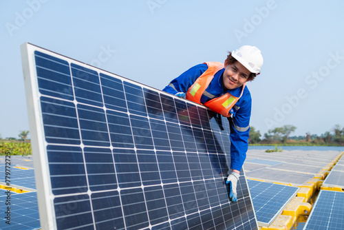 Technician Adjusting Solar Panel at Installation Site