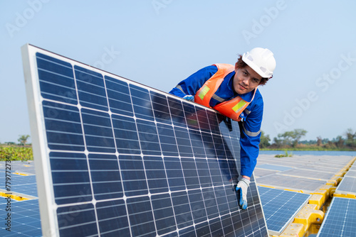 Technician Adjusting Solar Panel at Installation Site