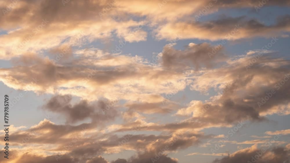 Timelapse on clouds moving through sky during a dramatic and beautiful sunset Timelapse on clouds moving through sky during a dramatic and beautiful sunset