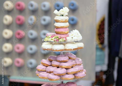 Colorful decorated donuts on a wedding party.