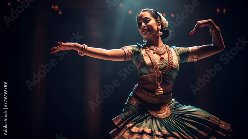 Portrait of classical indian dancer doing bharatanatyam on stage, performing cultural art