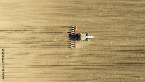 Aerial view of tractor sowing in agriculture area