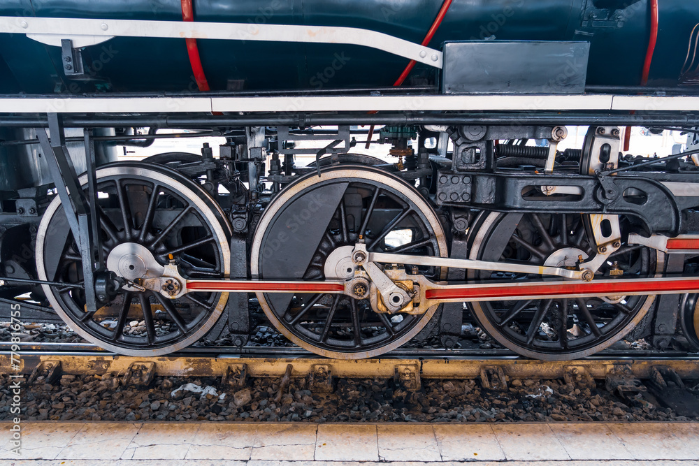 Close-up of wheels of an old retro steam train locomotive