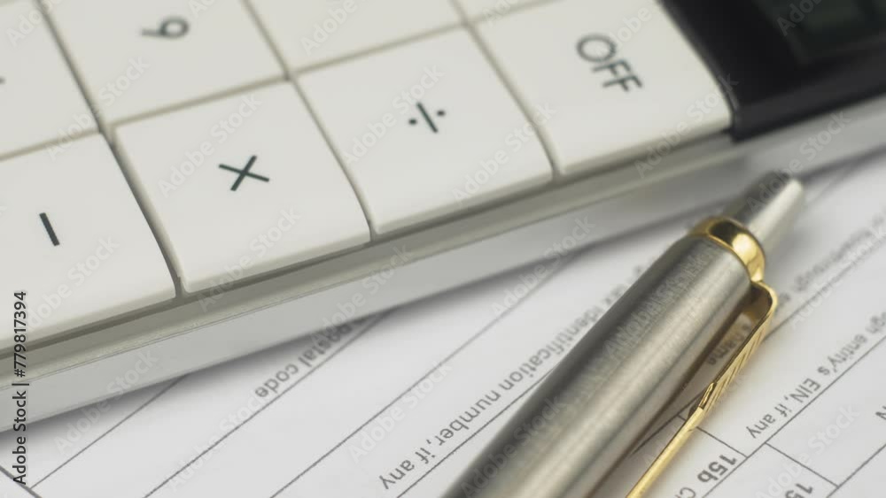 Form accounts using calculator, take notes in documents at workplace. Calculator and documents, pen, close up. Concept of paying taxes and filing tax return Form accounts using calculator, take notes in documents at workplace. Calculator and documents, pen, close up. Concept of paying taxes and filing tax return