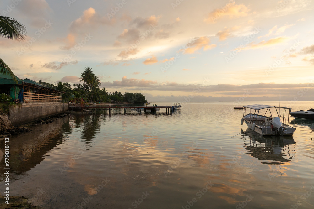 An idyllic evening vista of the lagoon that surrounds the lush South Pacific island of Mo'orea, French Polynesia. An idyllic evening vista of the lagoon that surrounds the lush South Pacific island of Mo'orea, French Polynesia.