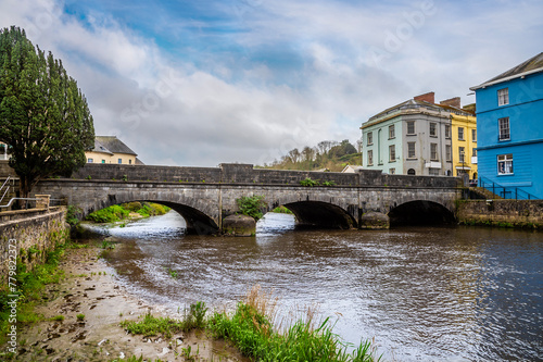 A view up the River Cleddau towards a road bridge in the centre of Haverfordwest, Pembrokeshire, Wales on a spring day photo