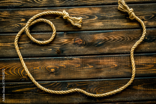 rope frame on wooden background top view mock-up
