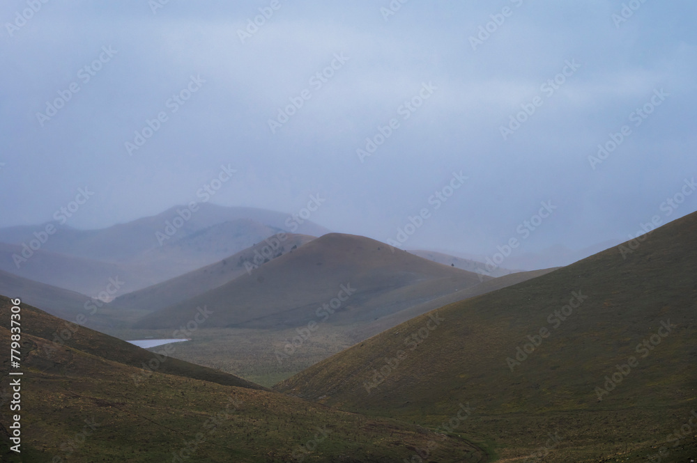 landscape inside Campo Imperatore during an autumnal cloudy day, Parco nazionale Gran Sasso, L'Aquila, Italy