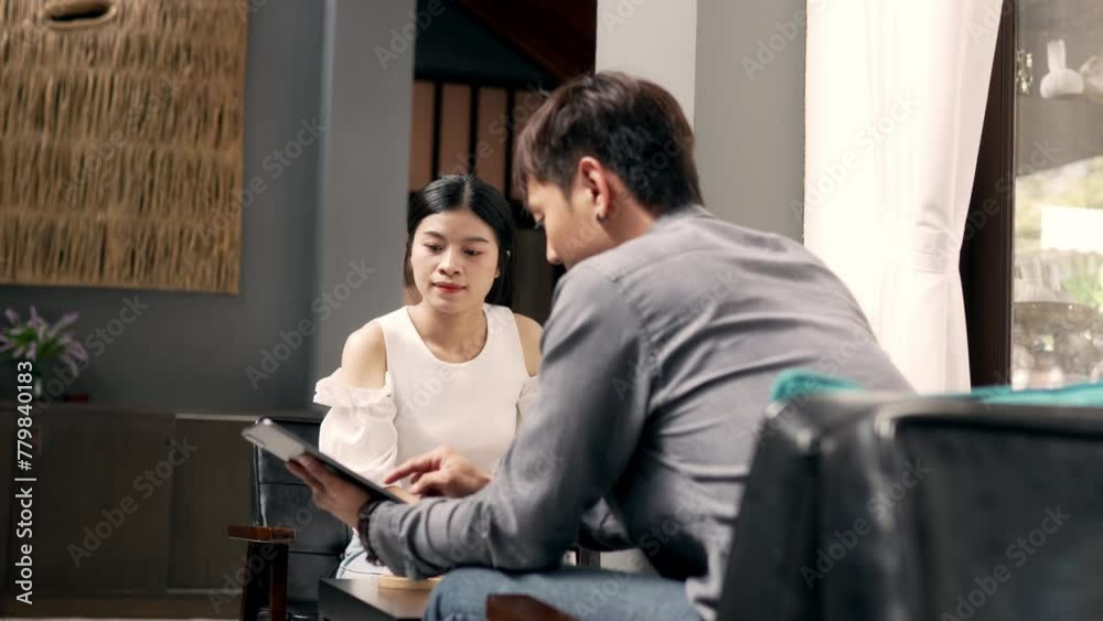 Smiling young Asian man friend talking and sharing massage experience in spa salon. Two Asian people talking in lobby. Smiling young Asian man friend talking and sharing massage experience in spa salon. Two Asian people talking in lobby.