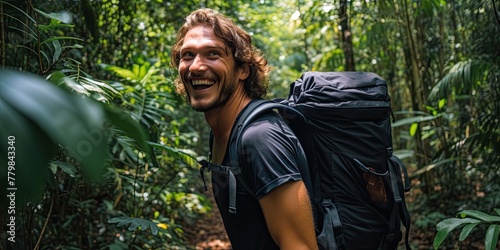 Hiker exploring tropical rainforest, with verdant foliage and lush greenery enveloping the trail.