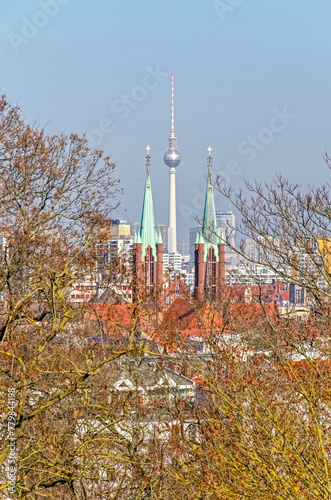 Berlin, Germany, March 8, 2024: view of the city from Kreuzberg mountain with the telveision tower seen between the towers of St Bonifatius church
