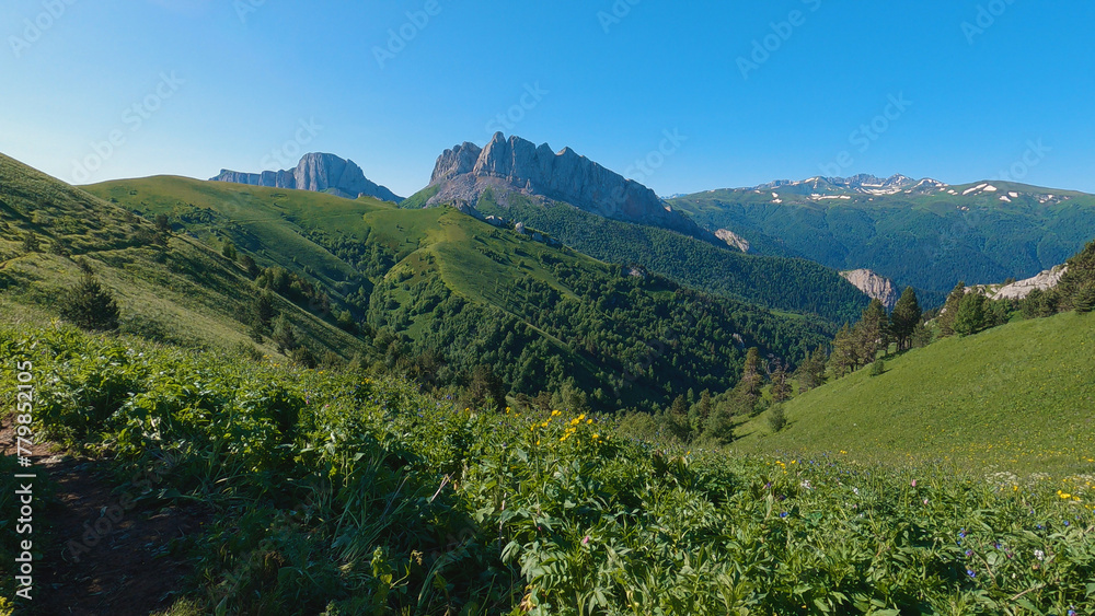 A breathtaking view of the Caucasus mountain range. Mount Chertovyi Vorota Devil's Gate . The photo shows snow-capped peaks, rugged terrain and untouched beauty of this high-mountain wilderness.