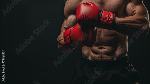 Men in boxing gloves on a dark background © Julia