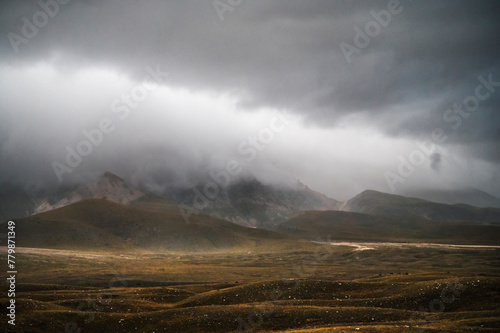 landscape inside Campo imperatore during an autumnal cloudy day, Parco nazionale del Gran Sasso, L'Aquila, Italy photo