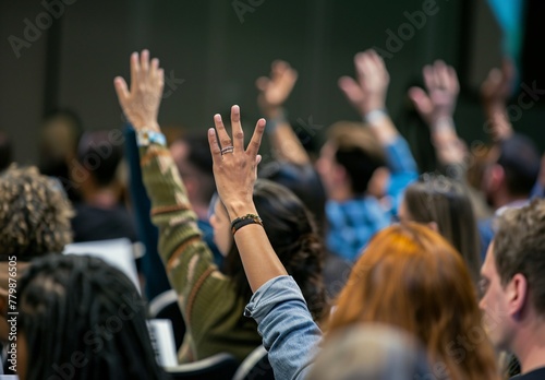 a group of people raising their hands © John