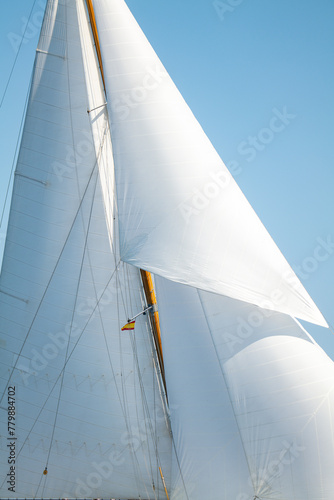 White Dacron sails on a classic wooden sail boat with wooden masts. © OUTSIDEIMAGES.COM