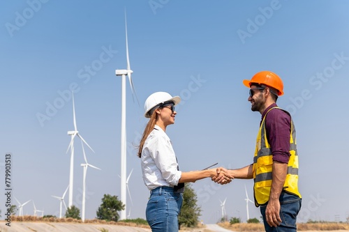 couple engineer team inspection check control wind power machine construction installation in wind energy factory. Two technician professional worker discussion for maintenance wind power turbine