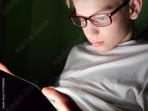 Slika na platnu Teenager watches something shocking on mobile phone or tablet