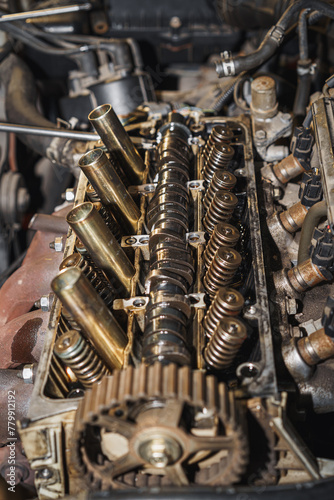 Close up of a car engine. Cylinder head. Valve. Valve springs. Sixteen valves. Car repairing. Auto service.
